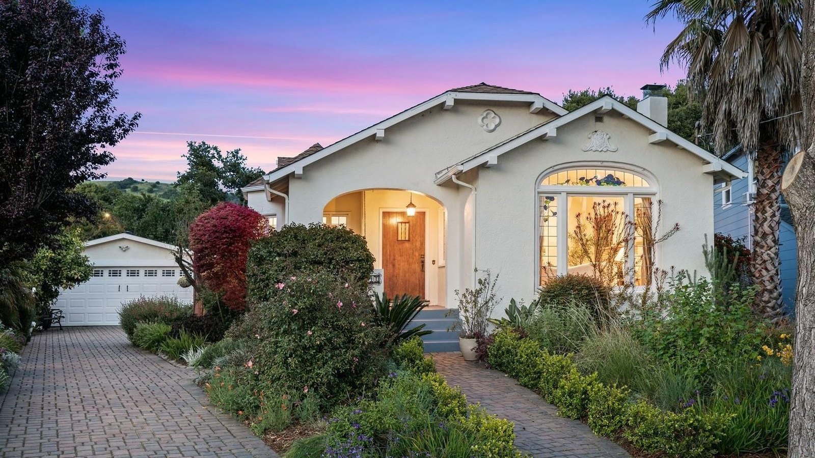 A Craftsman bungalow at dusk, one of Theresa's recent sales